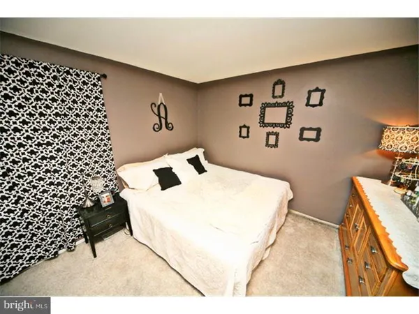 a bedroom with a bed and a cabinets