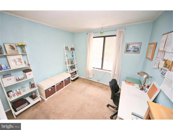 a bed room with a bed and a window