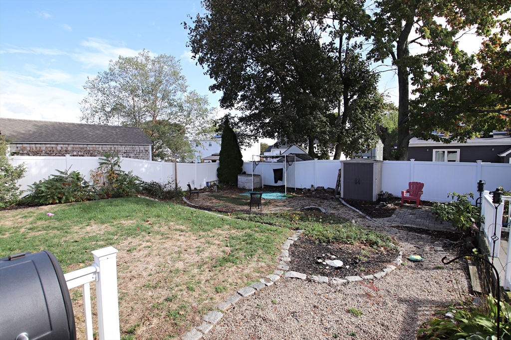 18 Nason Road Saugus, MA 01906 - Photo 24 of 31 a view of backyard with green space and seating area