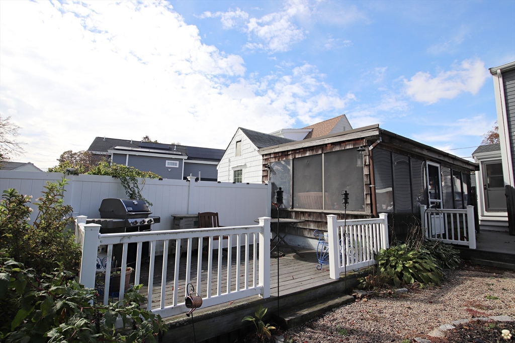 18 Nason Road Saugus, MA 01906 - Photo 26 of 31 a view of a house with wooden deck front and furniture