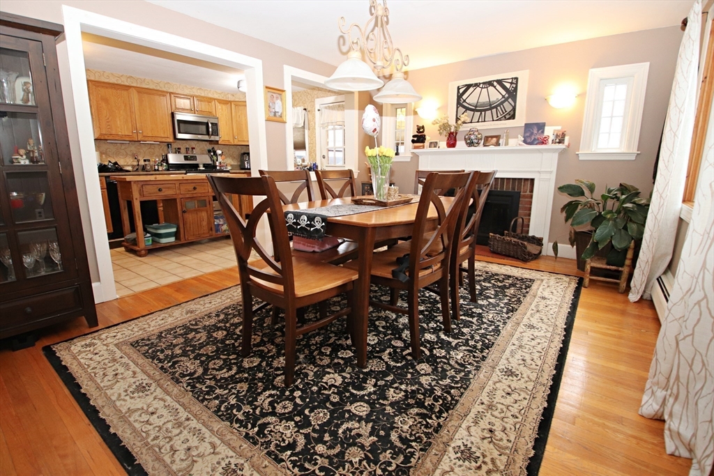 18 Nason Road Saugus, MA 01906 - Photo 7 of 31 a dining room with furniture a rug and wooden floor