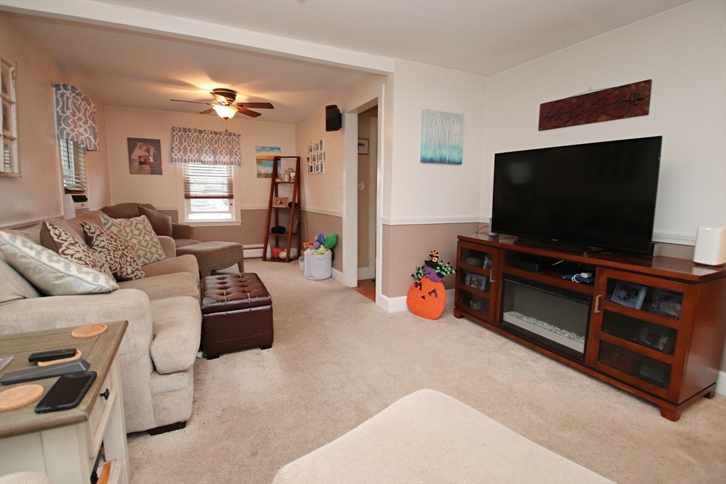 18 Nason Road Saugus, MA 01906 - Photo 9 of 31 a living room with furniture and a flat screen tv