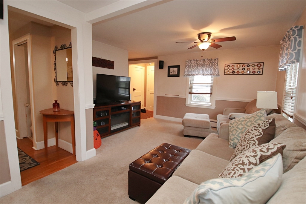 18 Nason Road Saugus, MA 01906 - Photo 10 of 31 a bedroom with furniture and a flat screen tv