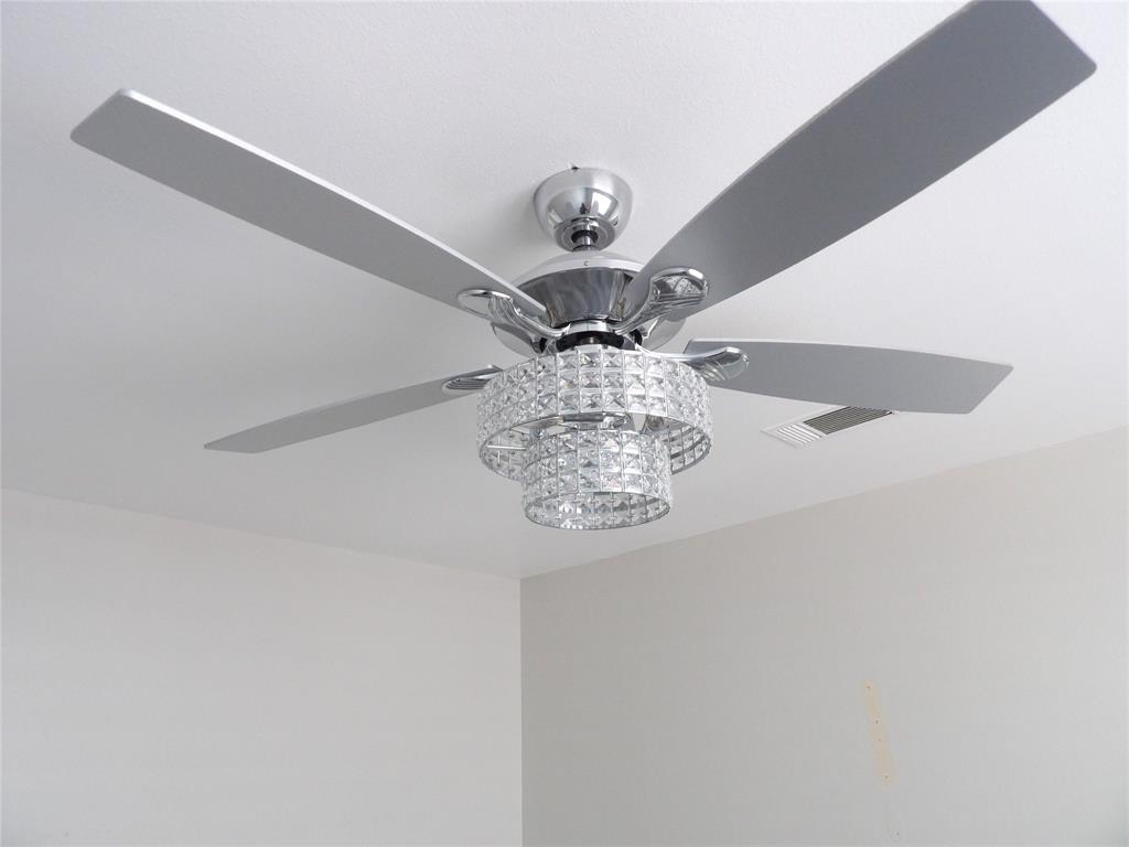 223 Juniper Ridge Court DeSoto, TX 75115 - Photo 16 of 33 Detailed view of hanging lights and ceiling fan