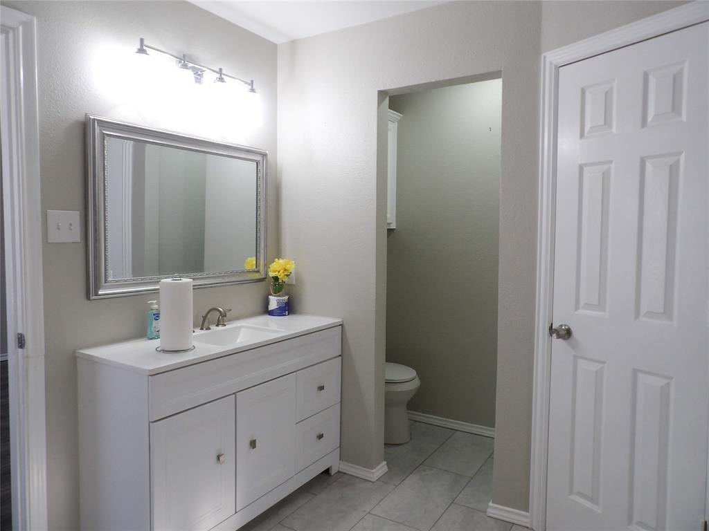 223 Juniper Ridge Court DeSoto, TX 75115 - Photo 17 of 33 Bathroom with vanity and light tile patterned floors