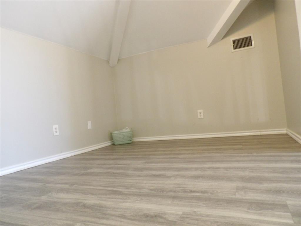 223 Juniper Ridge Court DeSoto, TX 75115 - Photo 22 of 33 Bonus room with lofted ceiling with beams and wood finished floors