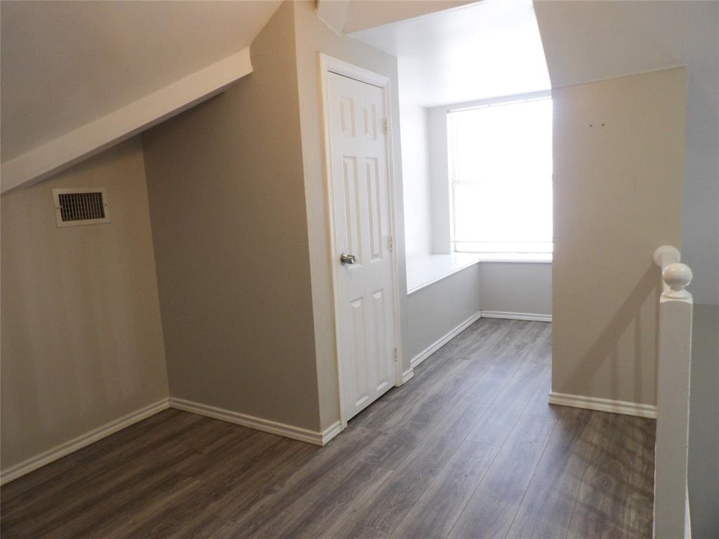 223 Juniper Ridge Court DeSoto, TX 75115 - Photo 23 of 33 Alternate view of Lofty Bonus room featuring dark wood-type flooring and baseboards