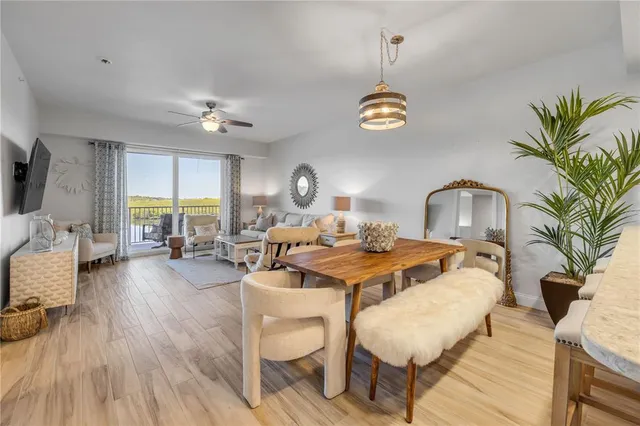 a view of a hallway with gallery and wooden floor