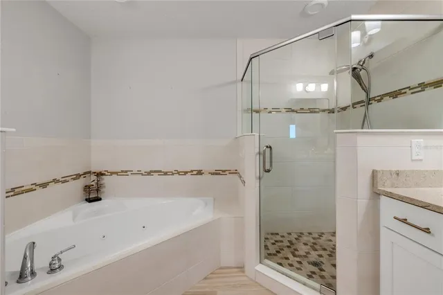 a bedroom with a bed and a lamp