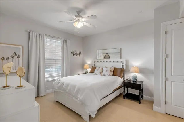 a bathroom with a granite countertop sink toilet and a mirror
