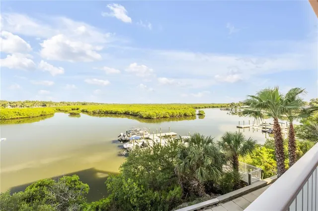 an aerial view of city and lake