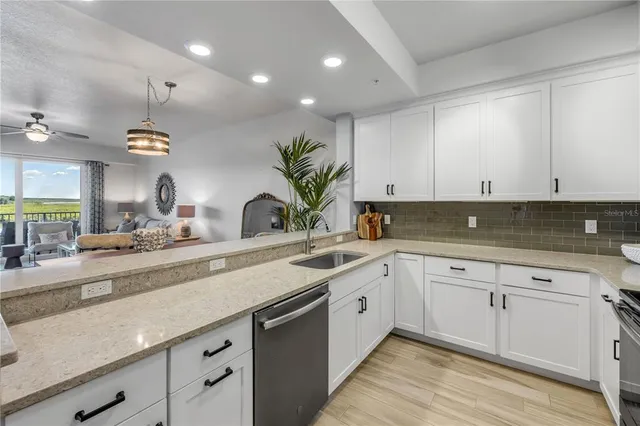 a kitchen with a sink and cabinets