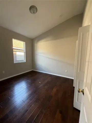 a view of an empty room and a window