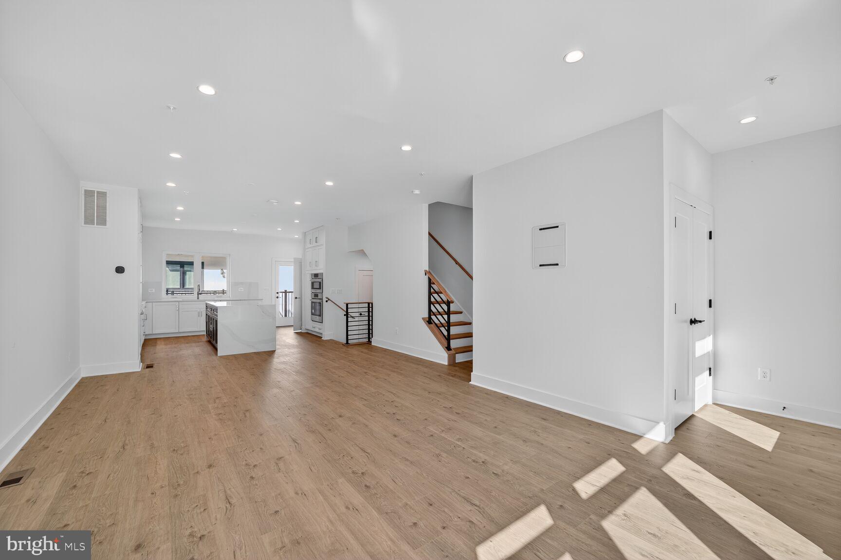 61 Lower Service Road Northwest, Unit HOMESITE 940 Washington, DC 20422 - Photo 14 of 26 a view of a kitchen with a refrigerator and a sink