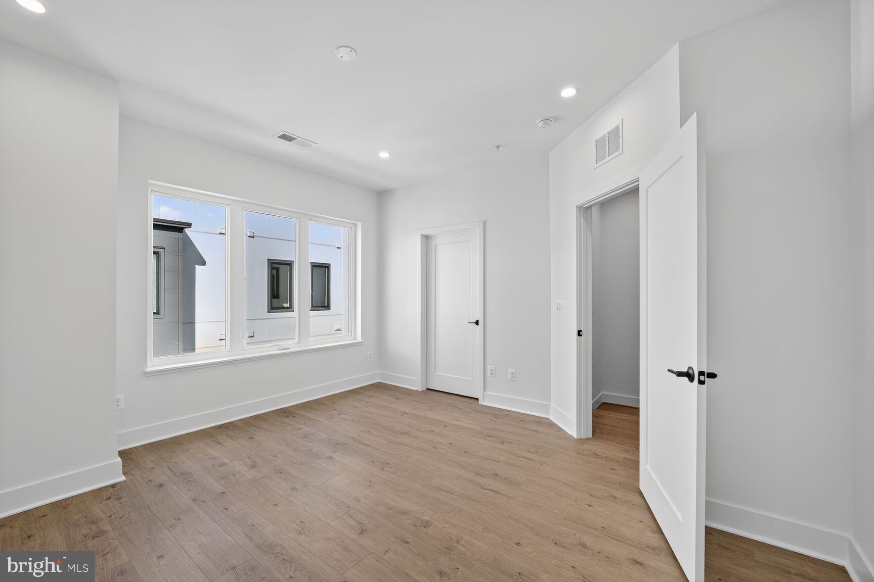 61 Lower Service Road Northwest, Unit HOMESITE 940 Washington, DC 20422 - Photo 15 of 26 a view of an empty room with a window