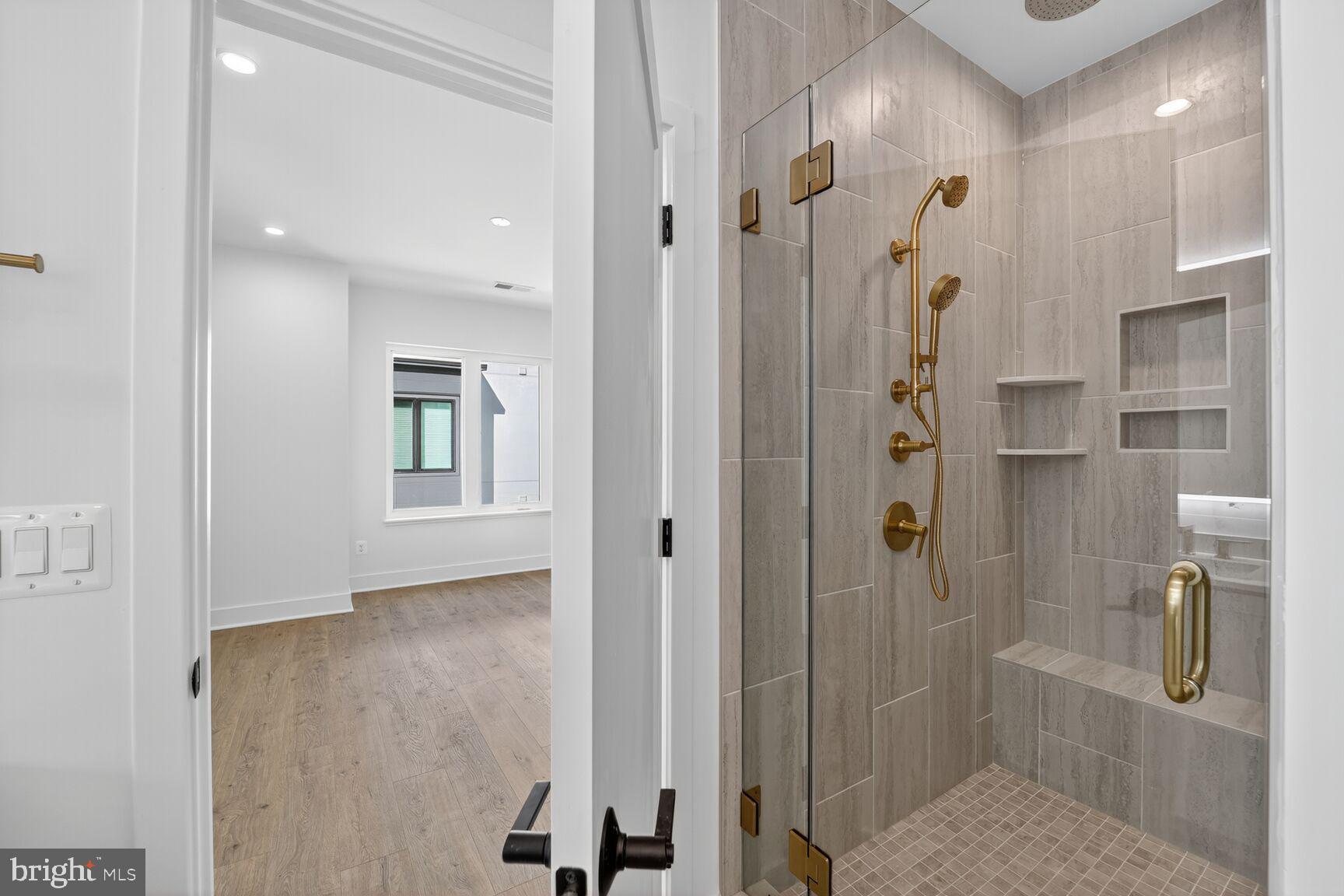 61 Lower Service Road Northwest, Unit HOMESITE 940 Washington, DC 20422 - Photo 16 of 26 a bathroom with a shower