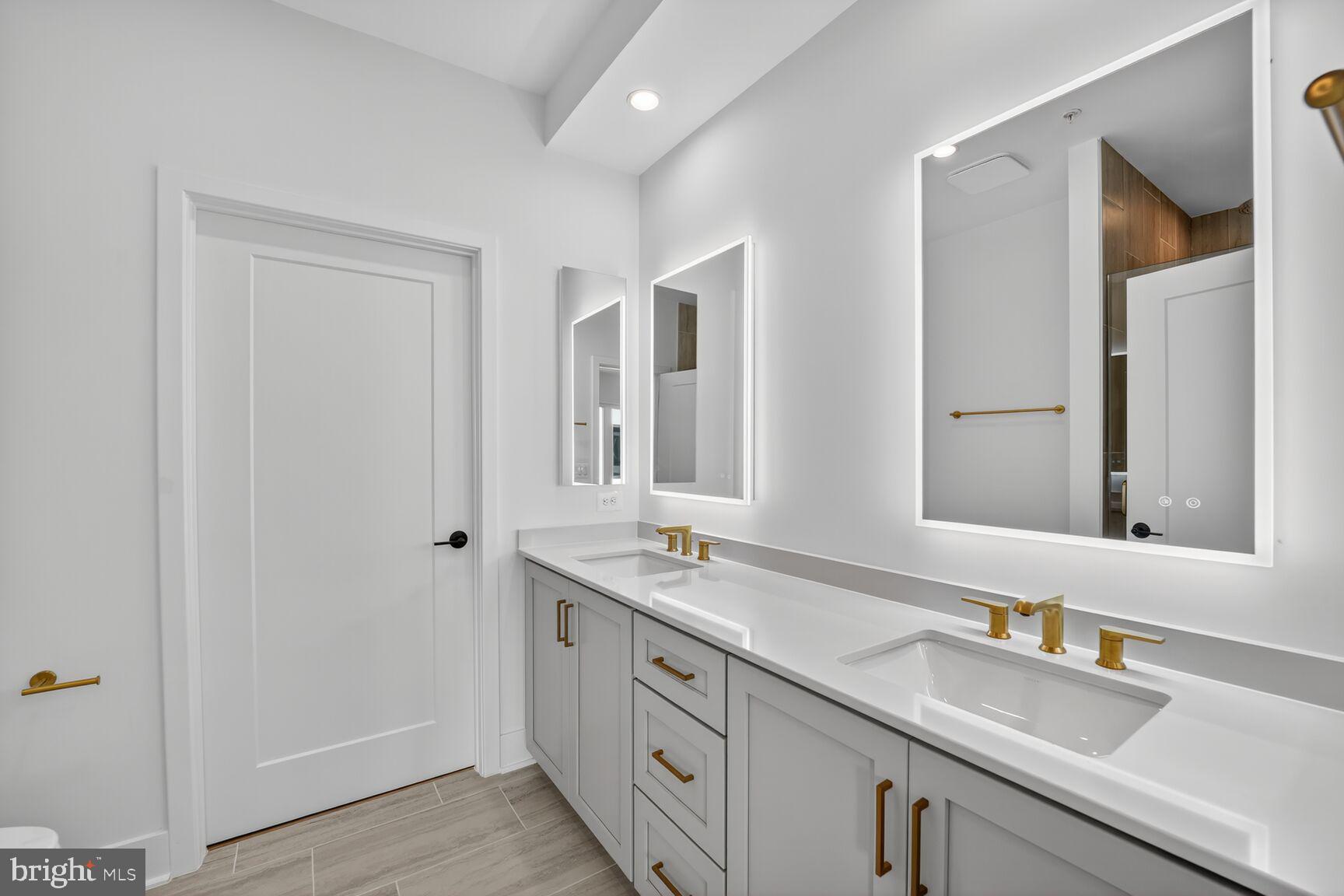 61 Lower Service Road Northwest, Unit HOMESITE 940 Washington, DC 20422 - Photo 17 of 26 a bathroom with double sink and a mirror
