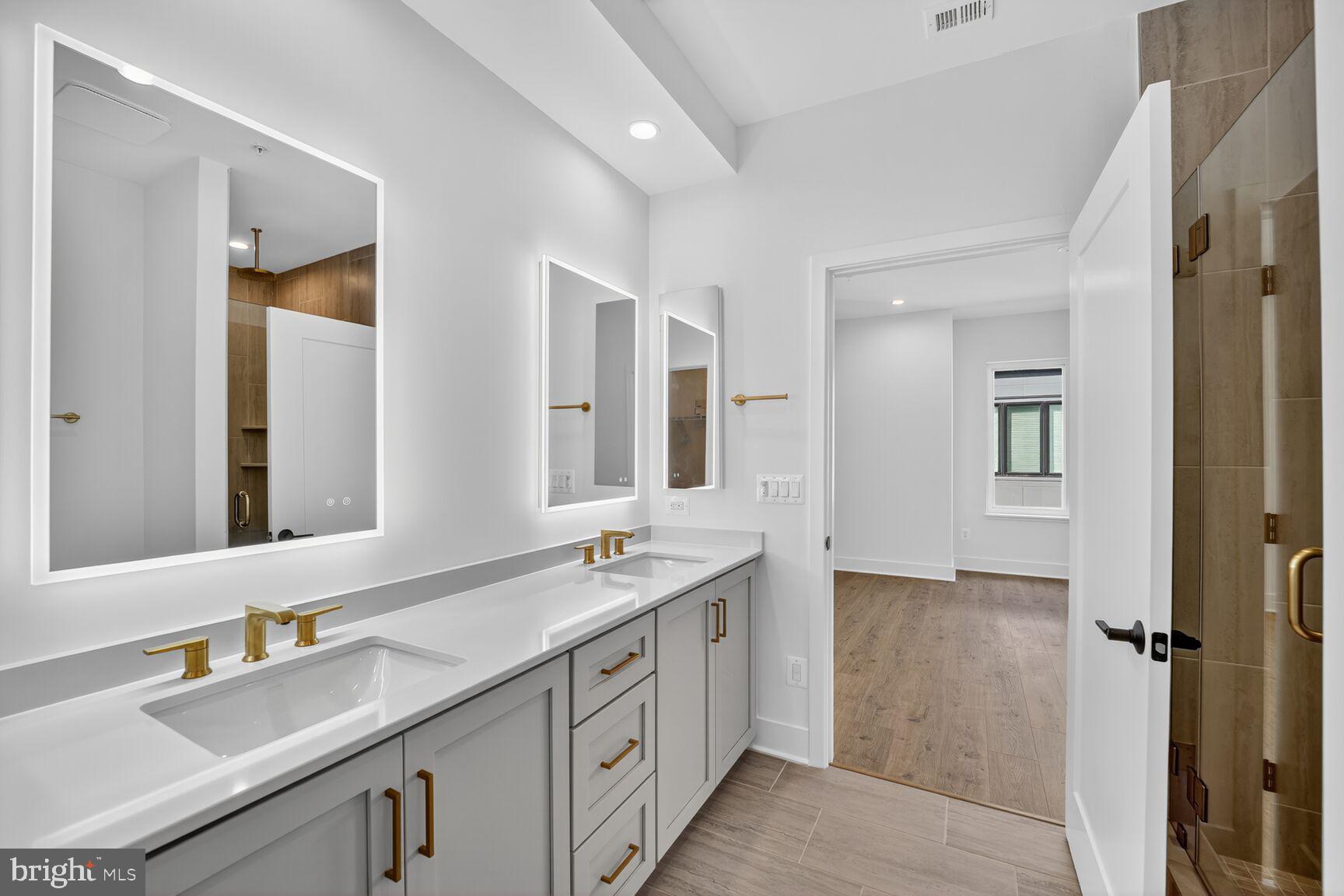 61 Lower Service Road Northwest, Unit HOMESITE 940 Washington, DC 20422 - Photo 18 of 26 a bathroom with a double vanity sink mirror and double