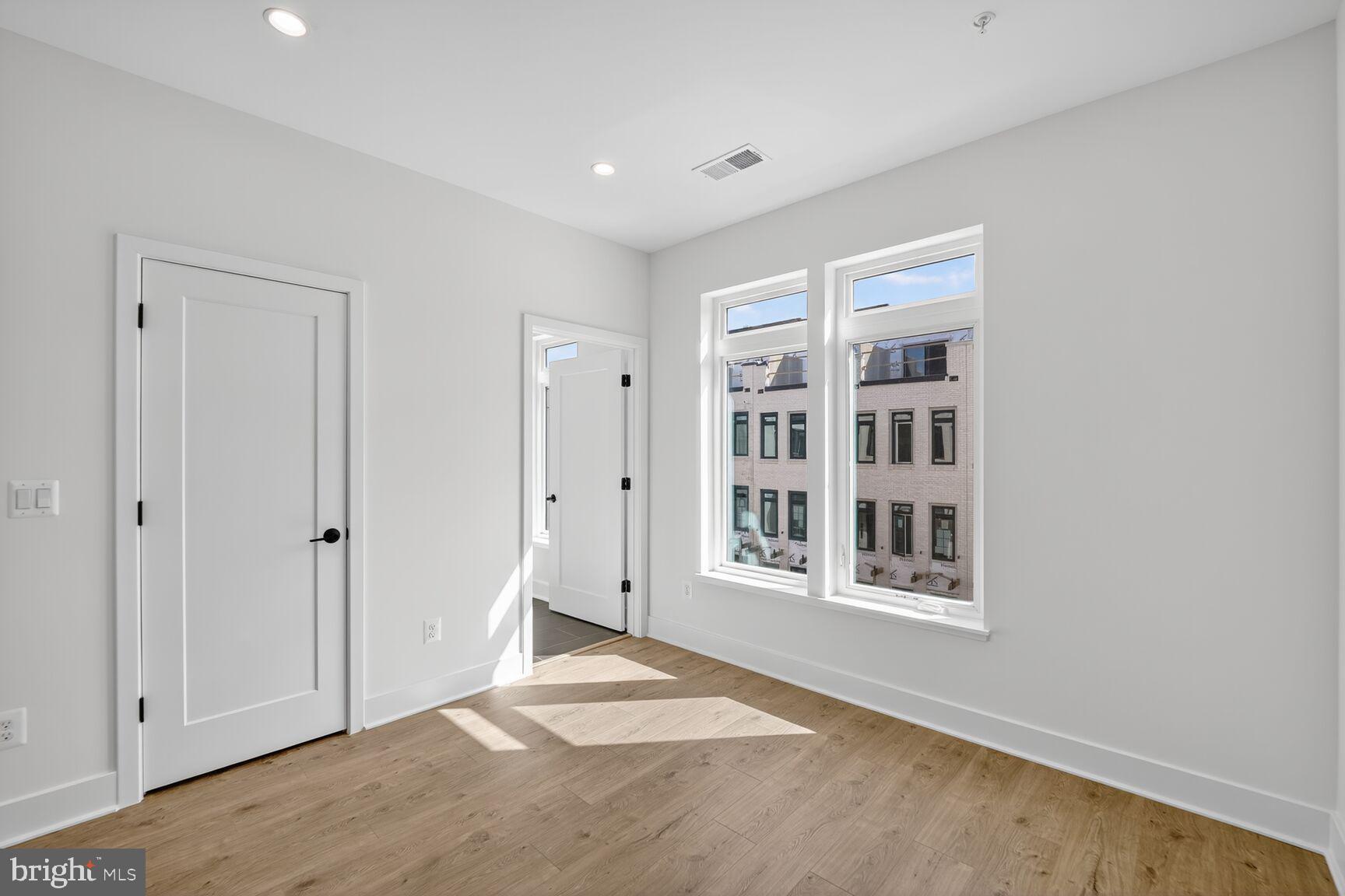 61 Lower Service Road Northwest, Unit HOMESITE 940 Washington, DC 20422 - Photo 20 of 26 an empty room with windows