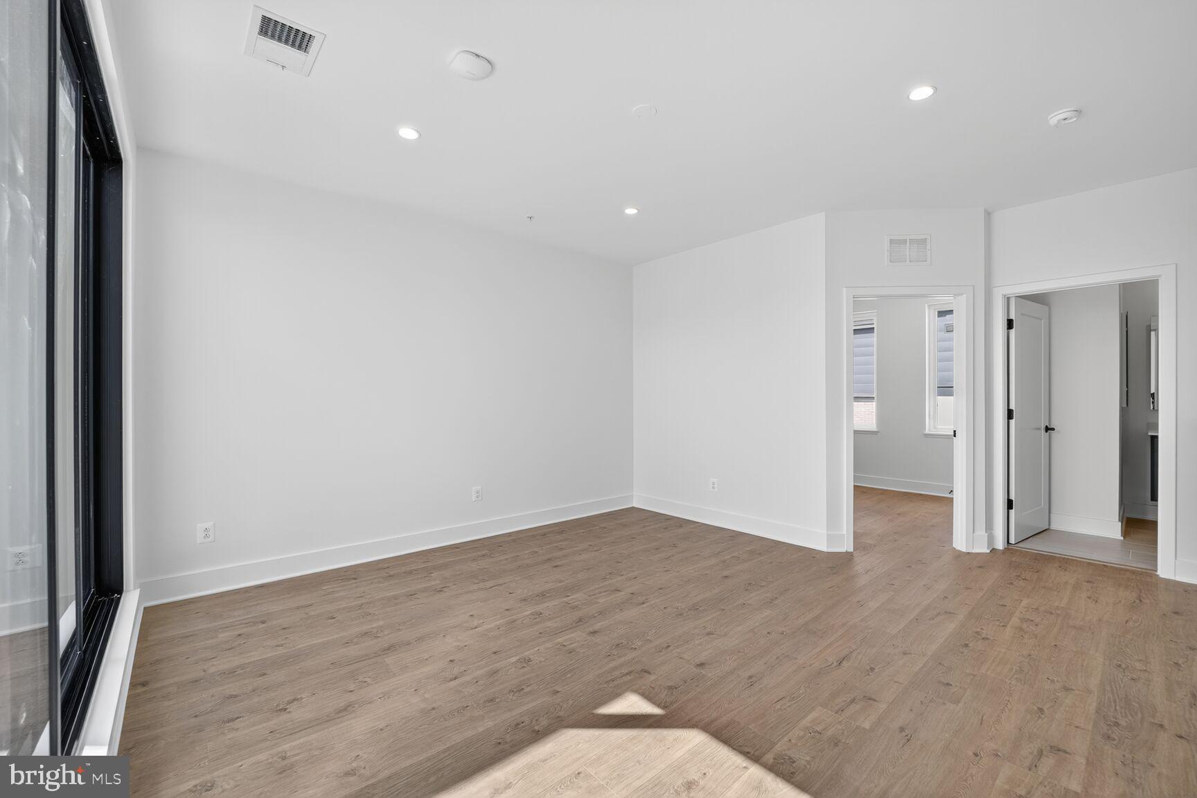 61 Lower Service Road Northwest, Unit HOMESITE 940 Washington, DC 20422 - Photo 25 of 26 a view of an empty room with wooden floor