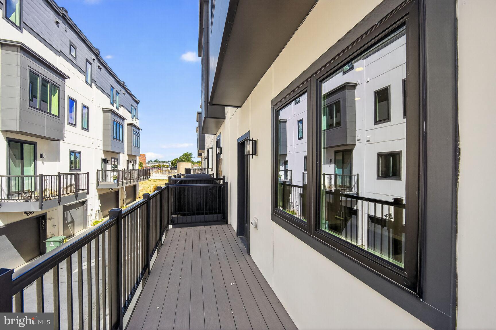 61 Lower Service Road Northwest, Unit HOMESITE 940 Washington, DC 20422 - Photo 26 of 26 a view of a balcony and dining room