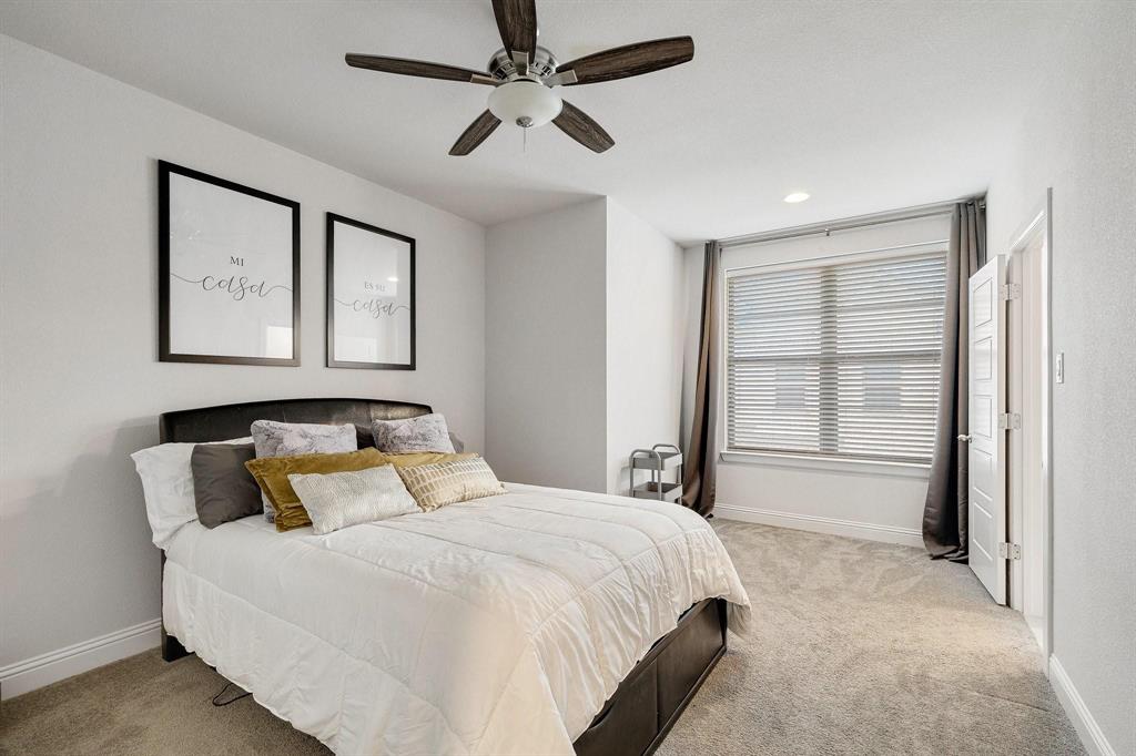 648 Aspen Valley Lane Dallas, TX 75208 - Photo 29 of 38 a bedroom with a large bed and closet