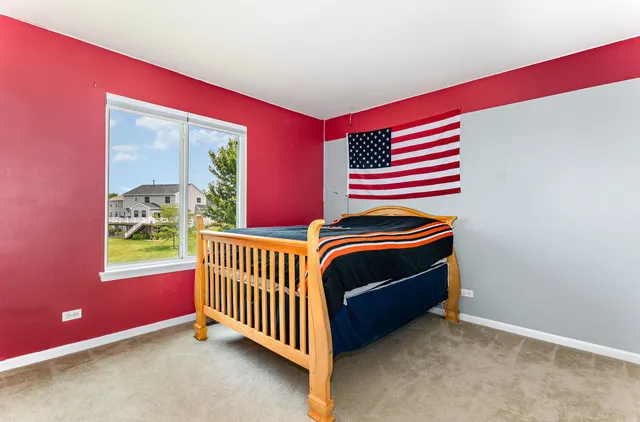 a room that has a bed and a window