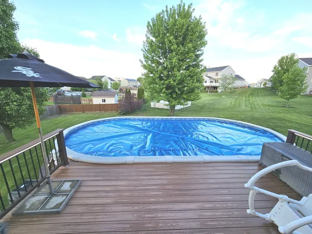 a view of a swimming pool with a patio