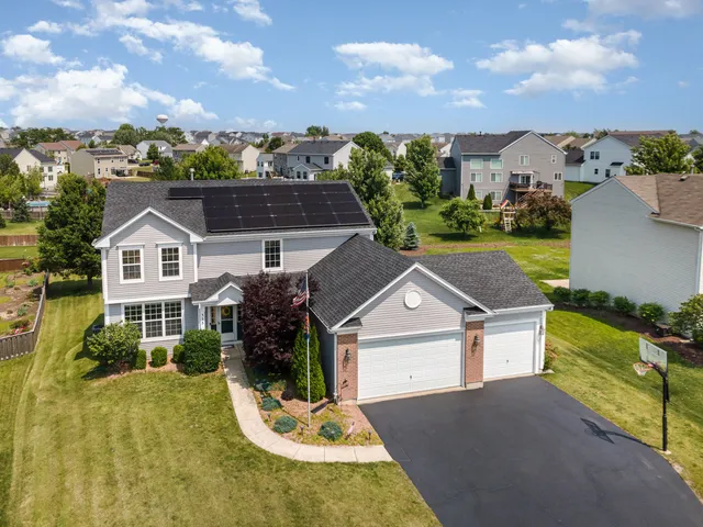 a backyard of a house with outdoor seating