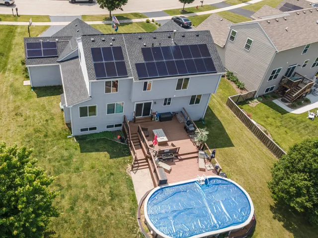 an aerial view of residential houses with outdoor space