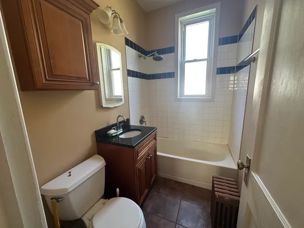 a bathroom with a toilet a sink and bathtub