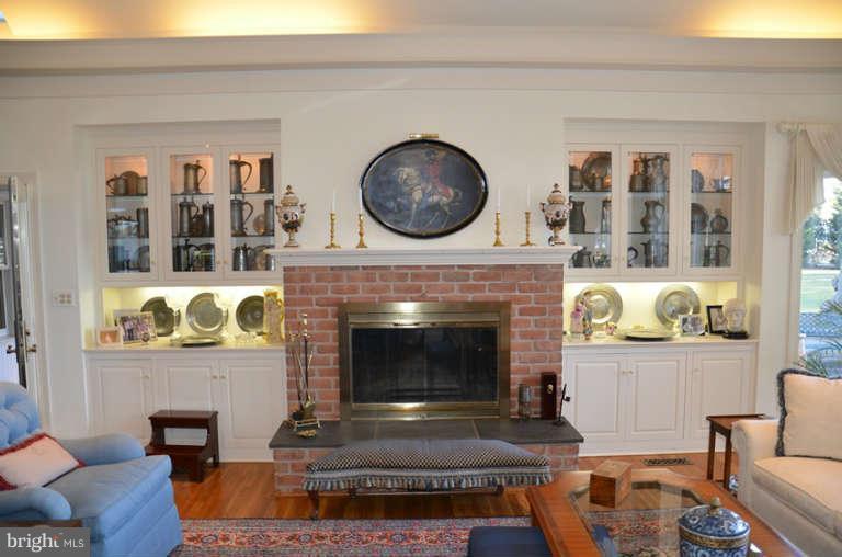 7891 Fuller Road St. Michaels, MD 21663 - Photo 13 of 23 a living room with furniture and a fireplace