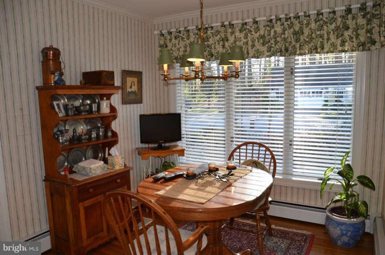 7891 Fuller Road St. Michaels, MD 21663 - Photo 17 of 23 a table and a potted plant sitting on a table