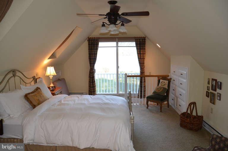 7891 Fuller Road St. Michaels, MD 21663 - Photo 20 of 23 a bedroom with a bed and a window