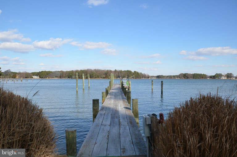 7891 Fuller Road St. Michaels, MD 21663 - Photo 6 of 23 a view of a terrace with wooden floor and lake view