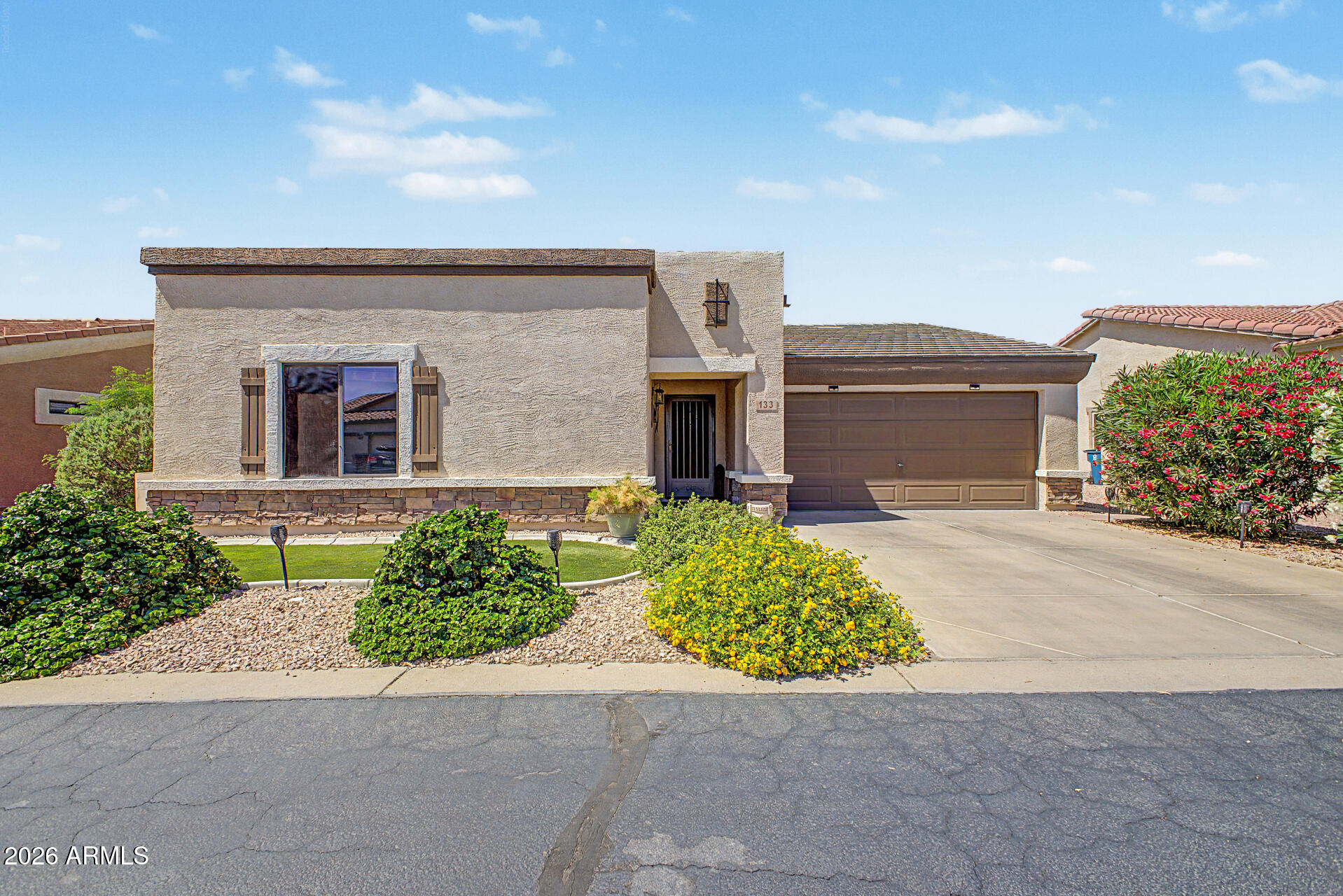 front view of a house with a yard