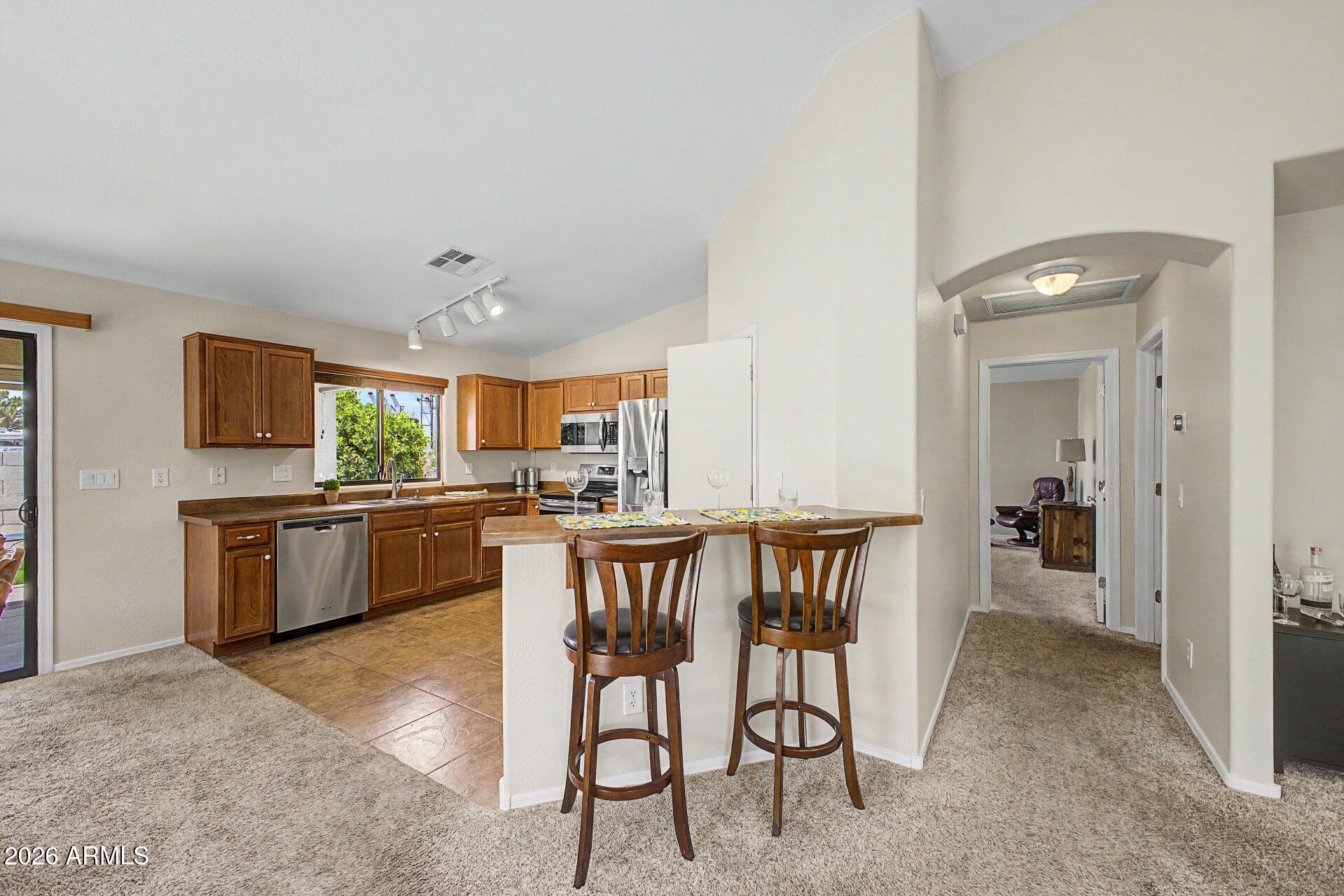 2101 South Meridian Road, Unit 133 Apache Junction, AZ 85120 - Photo 13 of 51 a kitchen with a table and chairs in it