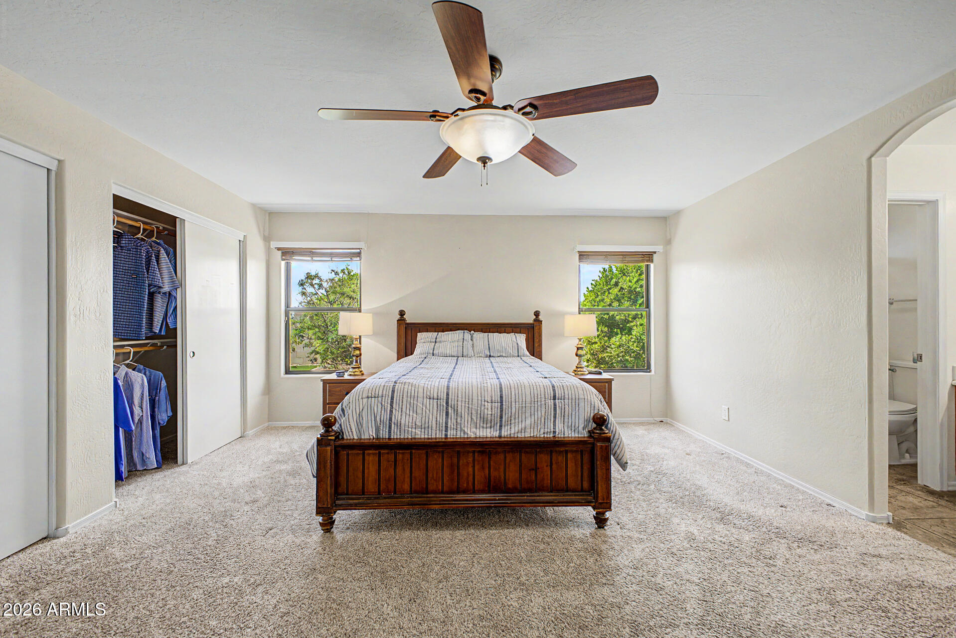 2101 South Meridian Road, Unit 133 Apache Junction, AZ 85120 - Photo 20 of 51 a bed sitting in a room next to a window