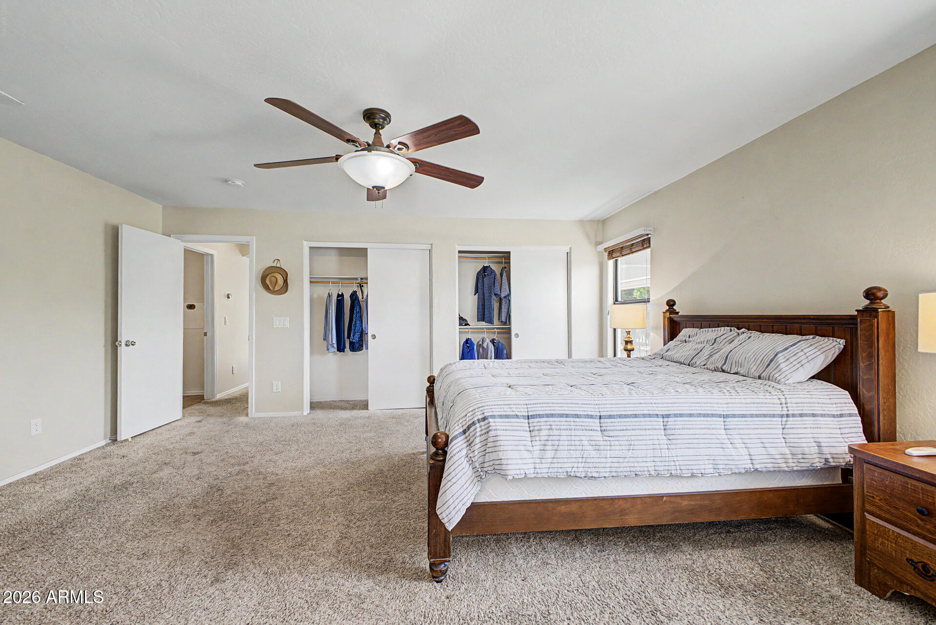 2101 South Meridian Road, Unit 133 Apache Junction, AZ 85120 - Photo 21 of 51 a bedroom with a bed and a ceiling fan