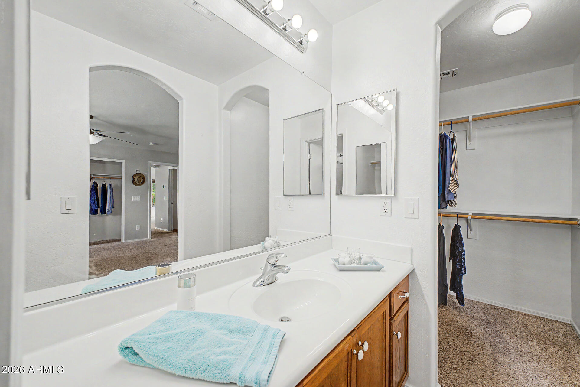 2101 South Meridian Road, Unit 133 Apache Junction, AZ 85120 - Photo 22 of 51 a bathroom with a double vanity sink and mirror