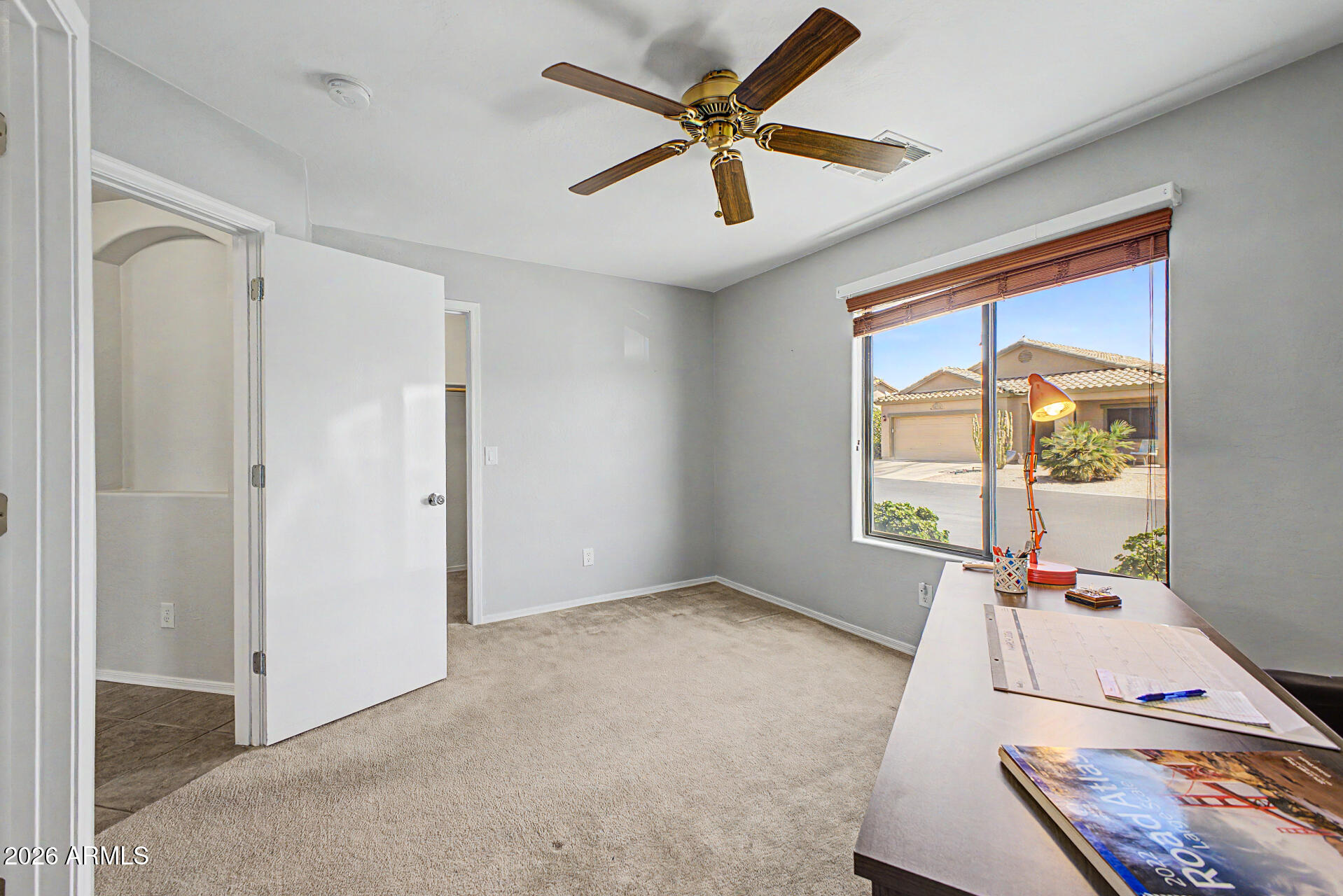 2101 South Meridian Road, Unit 133 Apache Junction, AZ 85120 - Photo 27 of 51 wooden floor in an empty room with a window