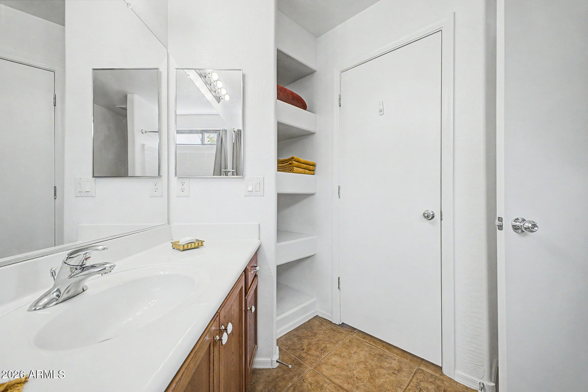 2101 South Meridian Road, Unit 133 Apache Junction, AZ 85120 - Photo 30 of 51 a bathroom with a sink and a mirror