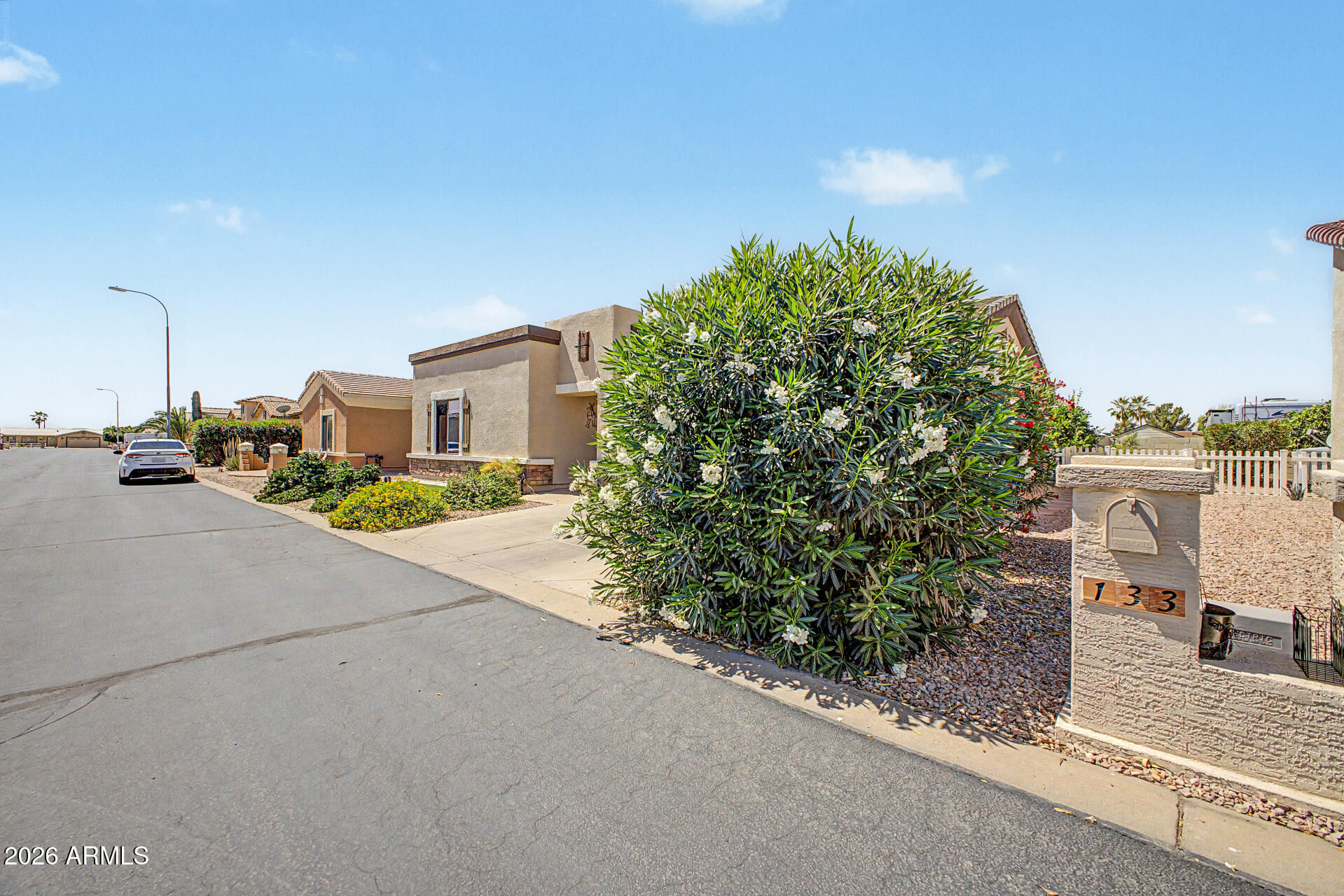 2101 South Meridian Road, Unit 133 Apache Junction, AZ 85120 - Photo 3 of 51 a street view with tall buildings and a street