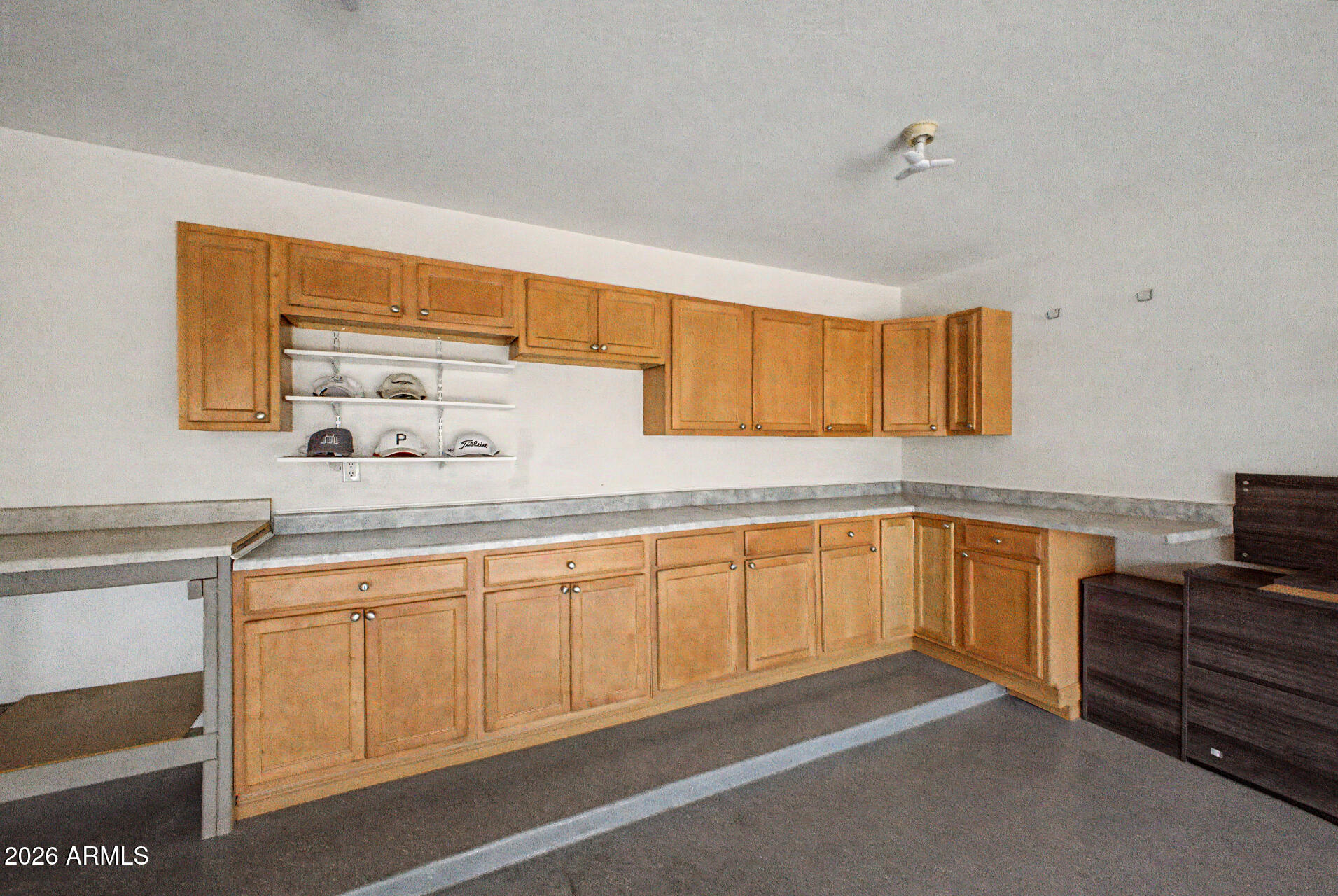 2101 South Meridian Road, Unit 133 Apache Junction, AZ 85120 - Photo 33 of 51 a kitchen with granite countertop a sink cabinets and wooden floor