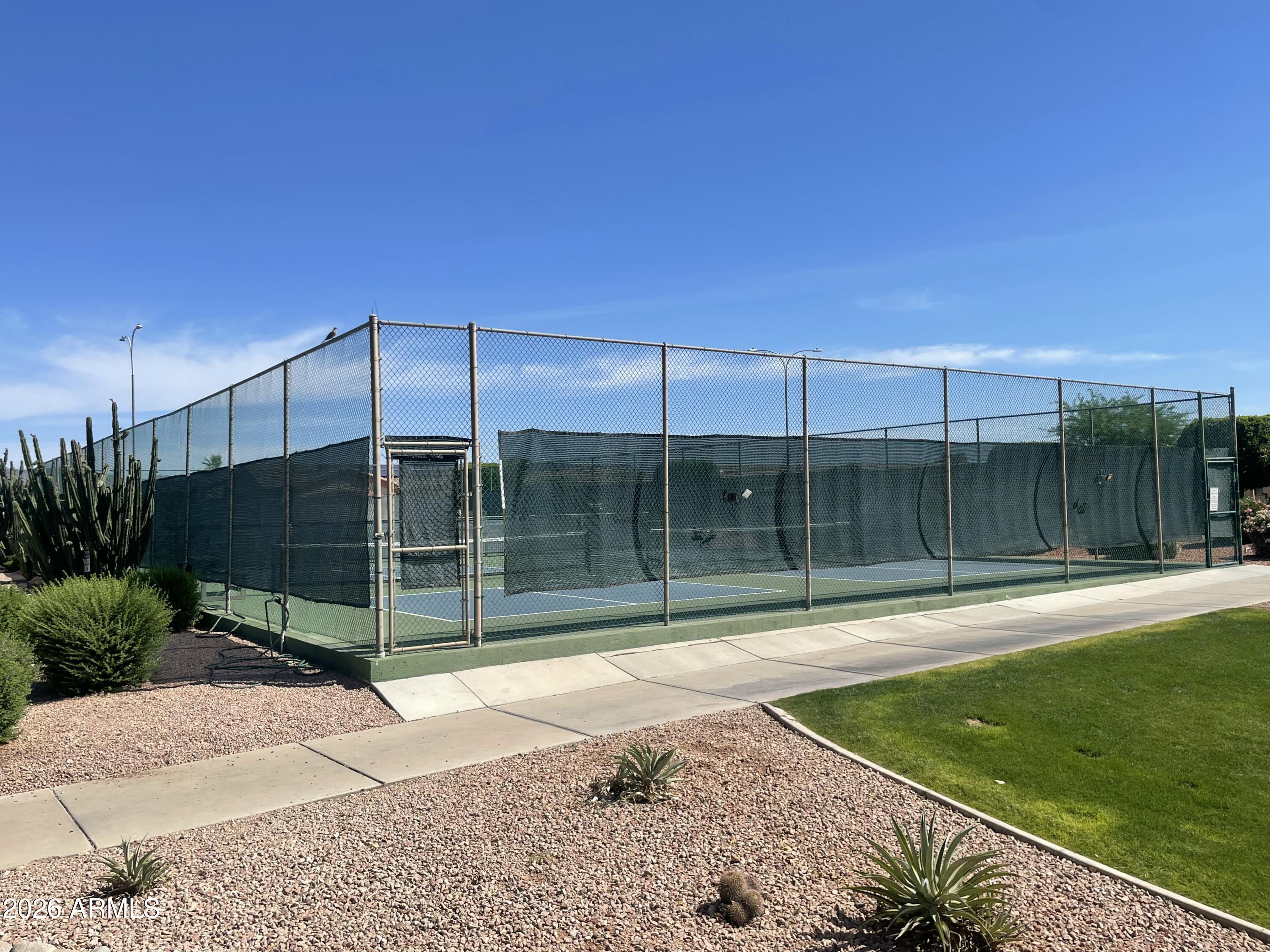 2101 South Meridian Road, Unit 133 Apache Junction, AZ 85120 - Photo 49 of 51 a view of a backyard with a garden and entertaining space