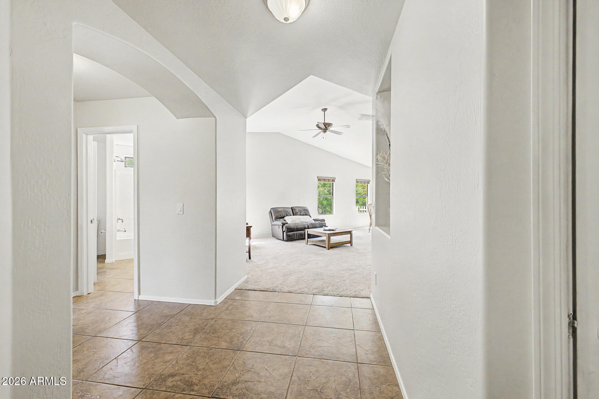 2101 South Meridian Road, Unit 133 Apache Junction, AZ 85120 - Photo 6 of 51 a view of a living room and bedroom