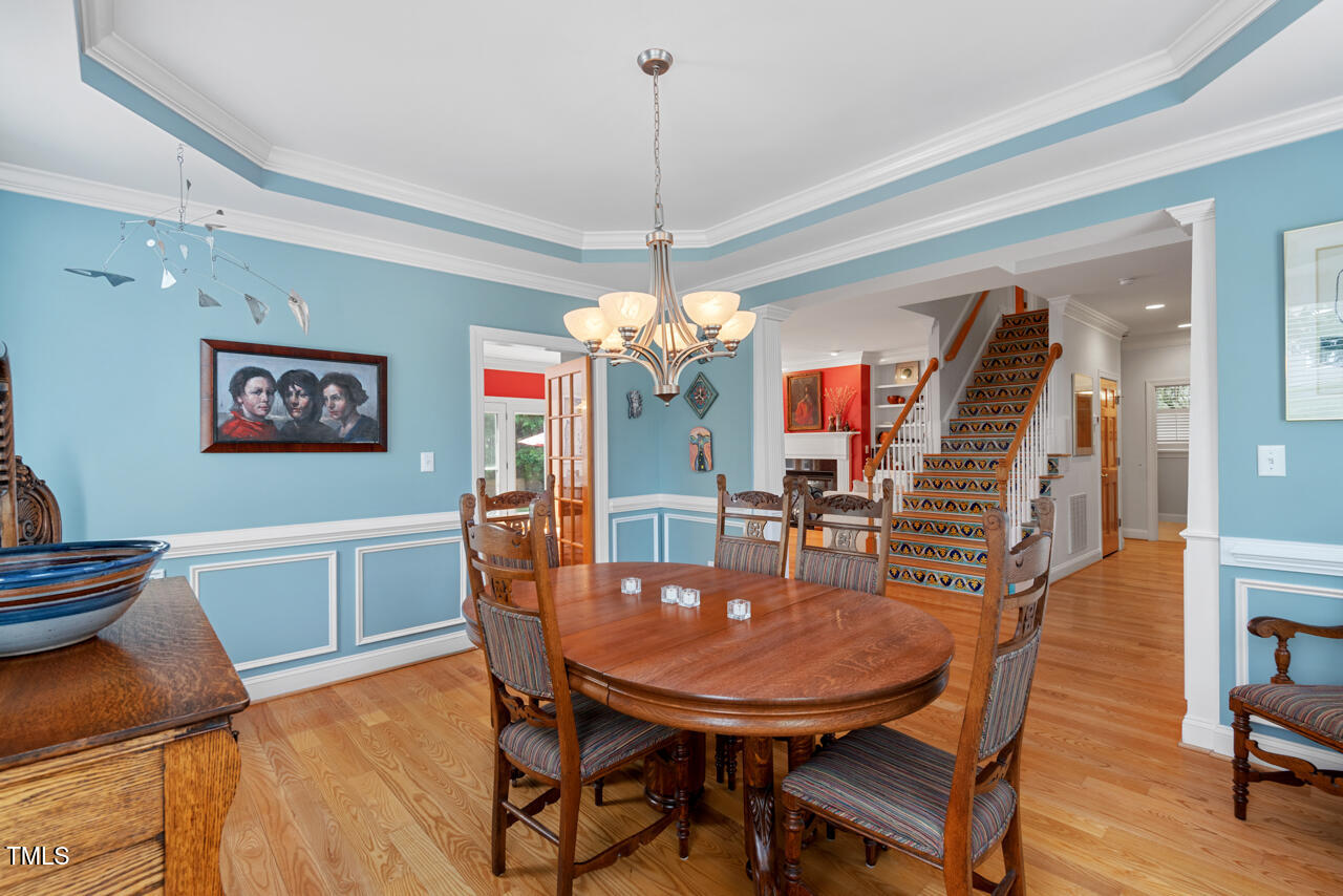 30119 Settle Chapel Hill, NC 27517 - Photo 11 of 49 a view of a dining room with furniture and wooden floor
