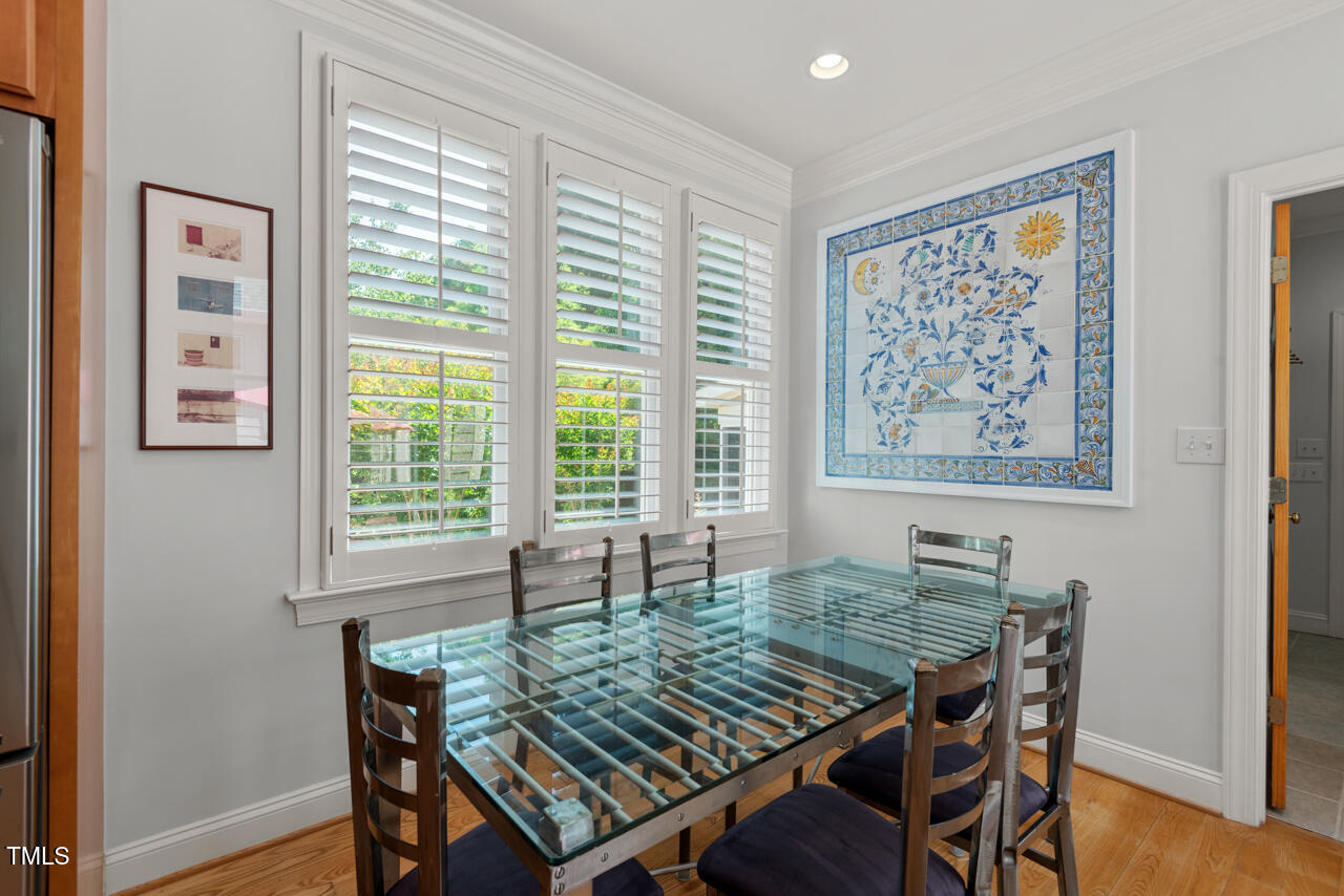 30119 Settle Chapel Hill, NC 27517 - Photo 22 of 49 a view of a dining room with furniture window and wooden floor