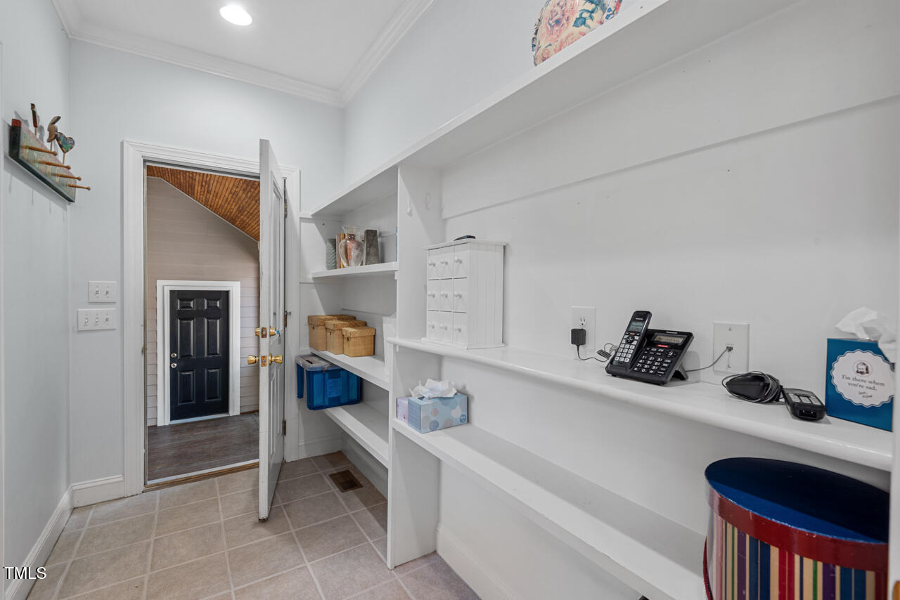 30119 Settle Chapel Hill, NC 27517 - Photo 24 of 49 a living room with furniture and a book shelf