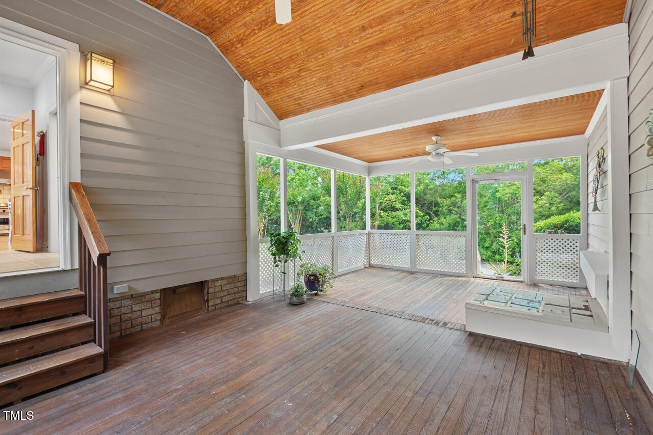 30119 Settle Chapel Hill, NC 27517 - Photo 27 of 49 a view of a room with wooden floor and a chair